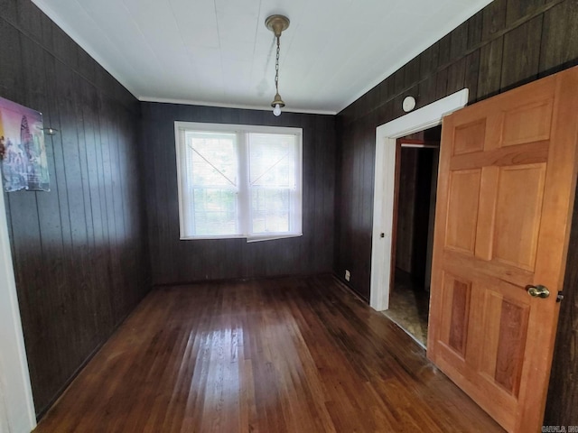 unfurnished dining area featuring dark hardwood / wood-style flooring