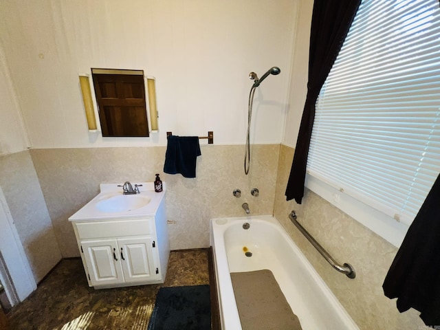 bathroom with vanity and a bathing tub