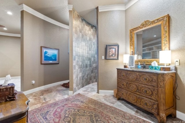 bathroom with vanity and ornamental molding