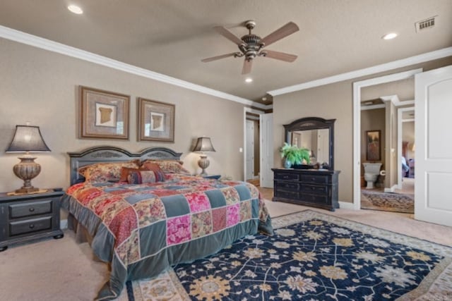 bedroom featuring carpet floors, ensuite bath, ceiling fan, and ornamental molding