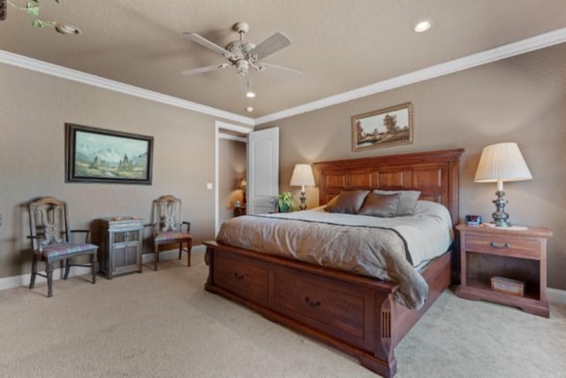 bedroom with ceiling fan, crown molding, and light colored carpet