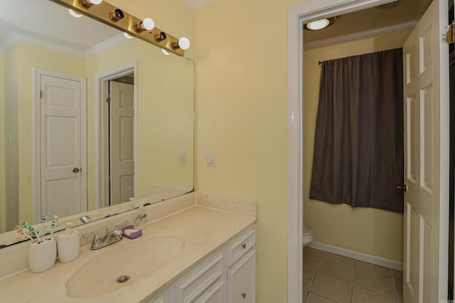 bathroom featuring tile patterned flooring, vanity, toilet, and ornamental molding