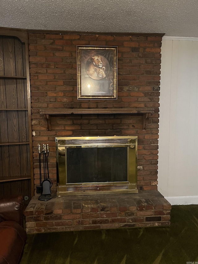 details with a textured ceiling and a brick fireplace