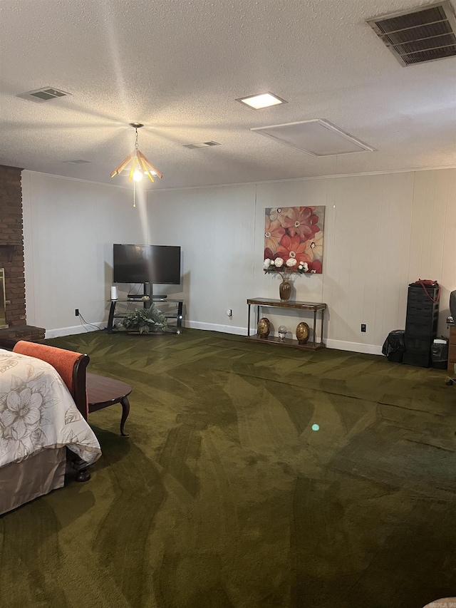 bedroom featuring carpet and a textured ceiling