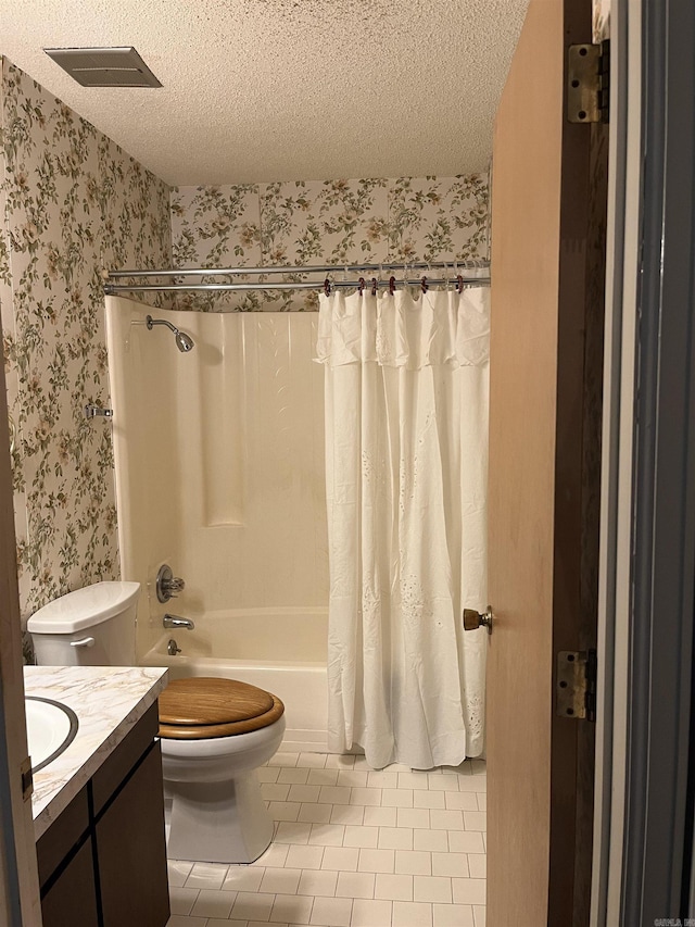 full bathroom featuring vanity, shower / bath combination with curtain, a textured ceiling, and toilet