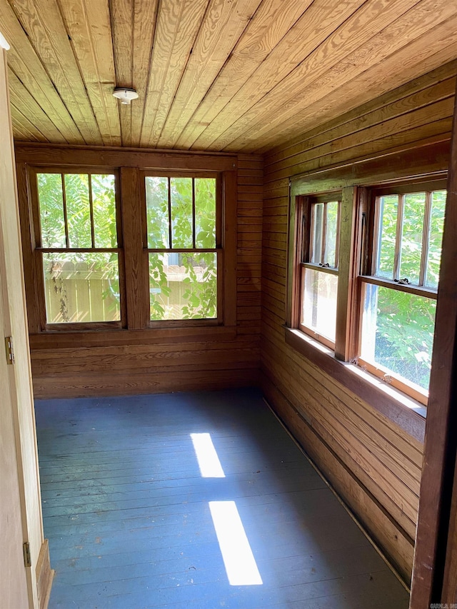 unfurnished sunroom featuring wooden ceiling