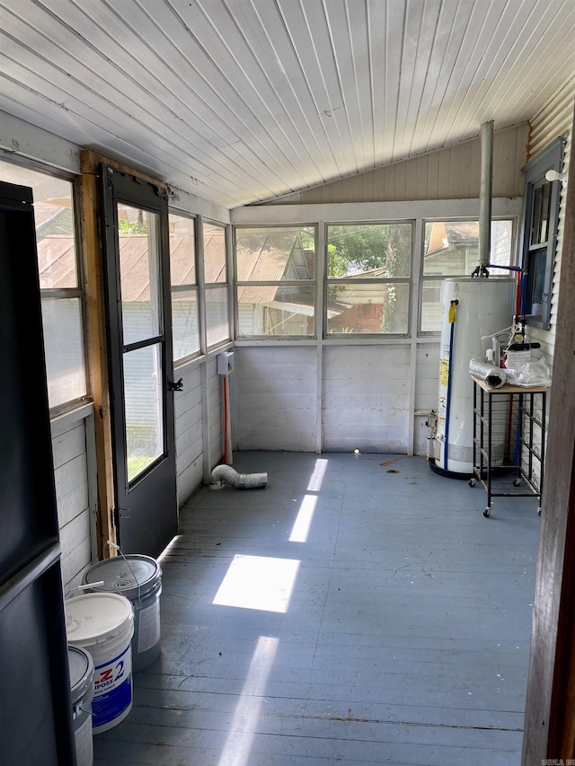 unfurnished sunroom with gas water heater, a wealth of natural light, lofted ceiling, and wood ceiling