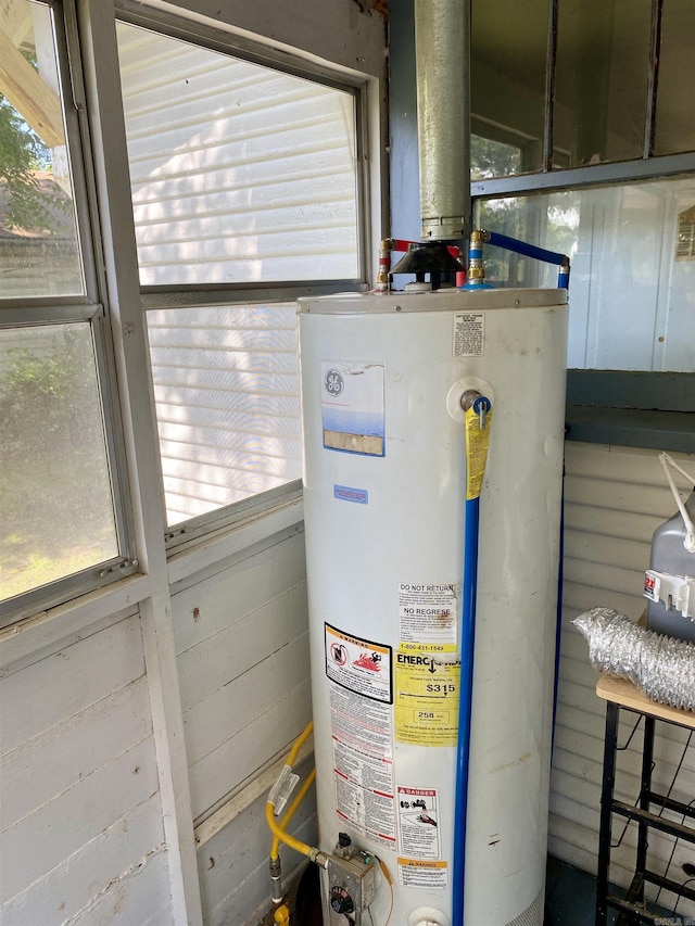 utility room with gas water heater