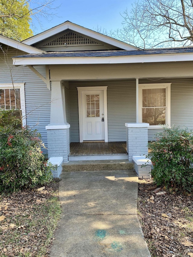 doorway to property with a porch