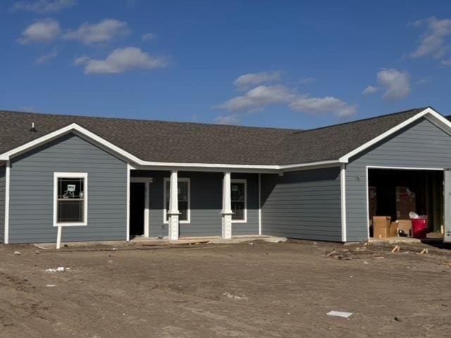 ranch-style home featuring a garage