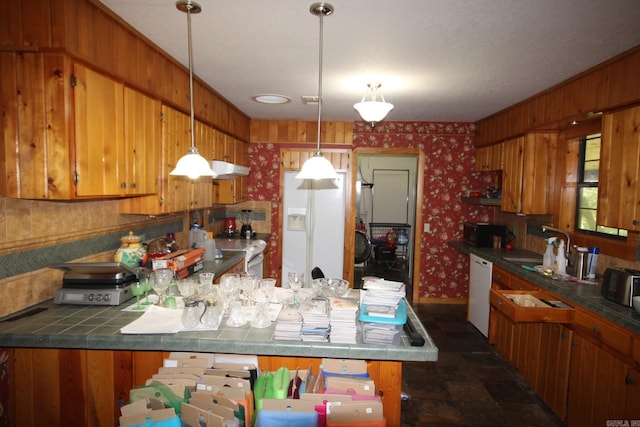 152 Hempstead 336, Mccaskill, AR 71847 - kitchen with white appliances, wallpapered walls, brown cabinetry, a peninsula, and baseboards