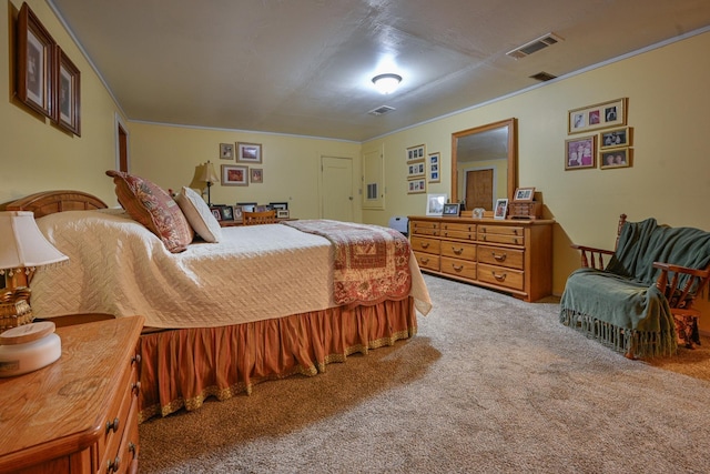 bedroom with ornamental molding and carpet