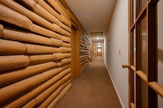 hallway with rustic walls and carpet