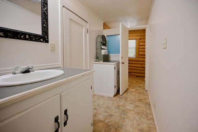 bathroom with sink and rustic walls