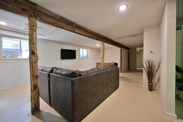 living room with beam ceiling