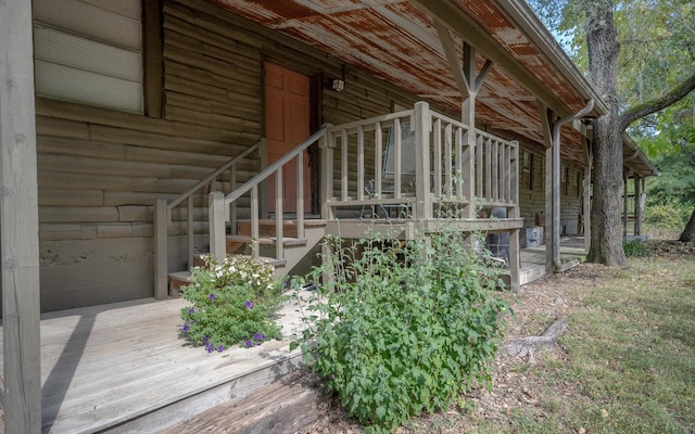 view of side of home with a wooden deck