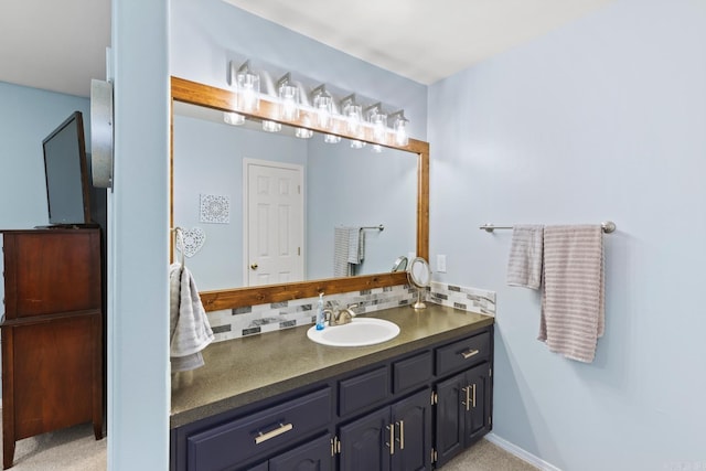 bathroom with tasteful backsplash and vanity