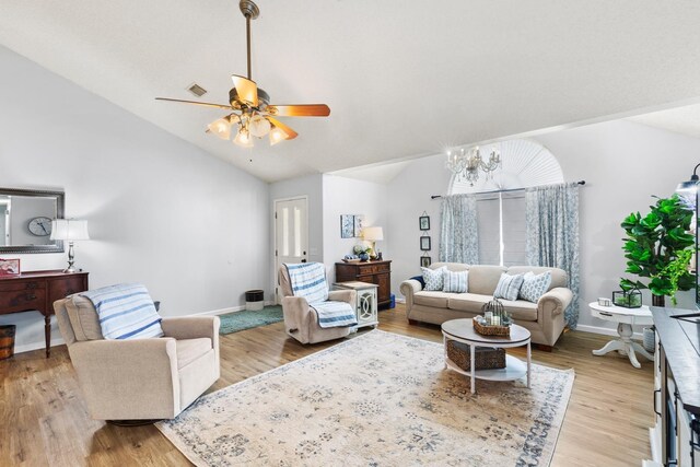 living room featuring light wood-type flooring, ceiling fan, and vaulted ceiling