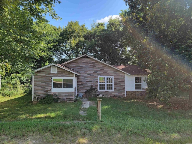 exterior space with a front yard