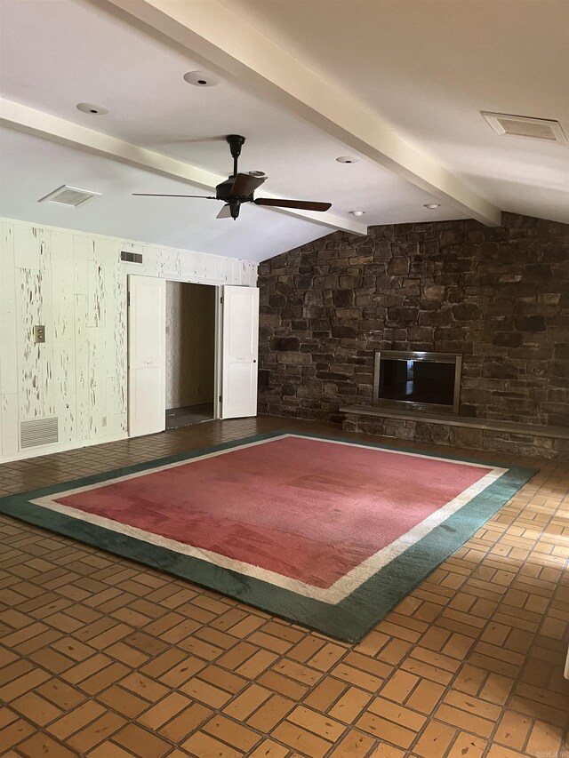 interior space with vaulted ceiling with beams and ceiling fan