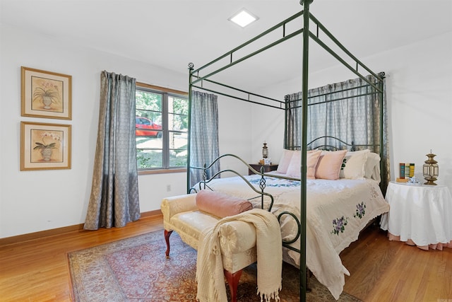 bedroom with hardwood / wood-style floors