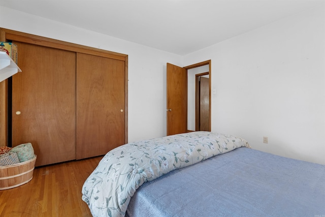 bedroom featuring a closet and hardwood / wood-style flooring