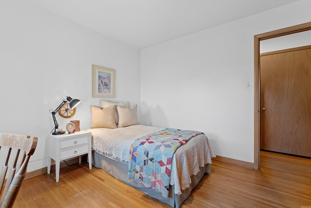 bedroom with light hardwood / wood-style floors