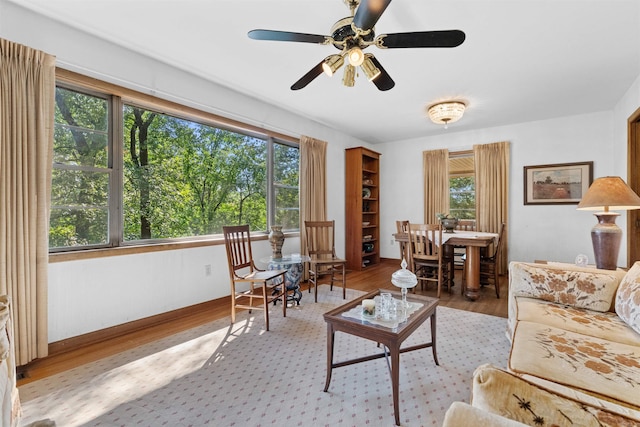 living room with a healthy amount of sunlight, hardwood / wood-style floors, and ceiling fan