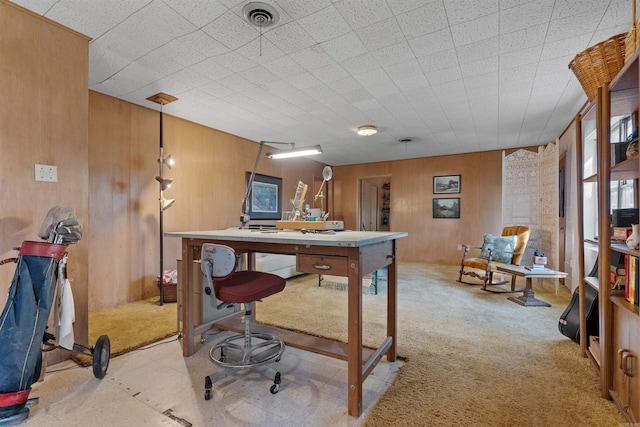 carpeted office with wood walls