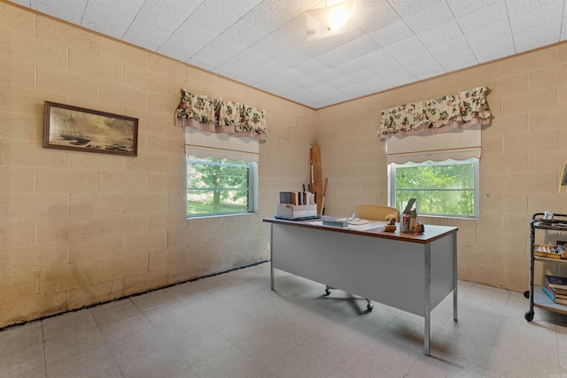 tiled home office featuring a wealth of natural light