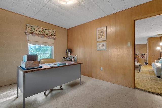 tiled office space with wood walls