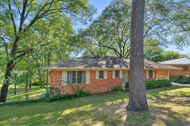 view of side of home featuring a yard