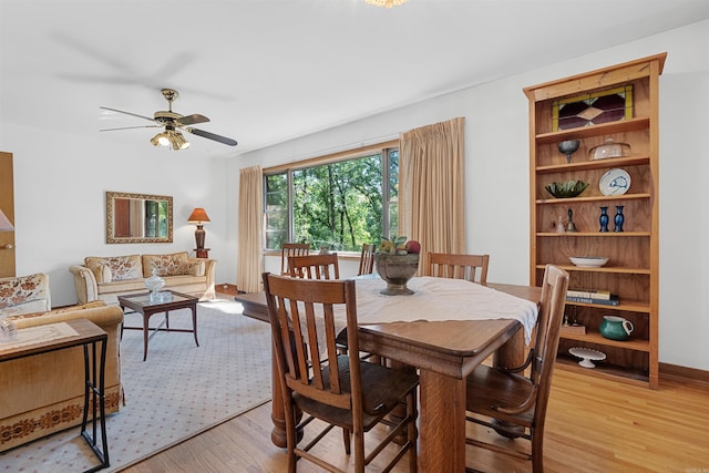 dining room featuring ceiling fan and light hardwood / wood-style flooring