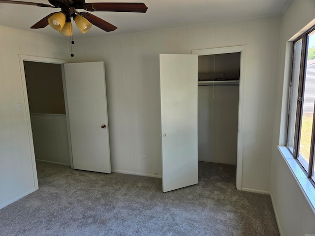 unfurnished bedroom featuring a closet, carpet floors, and ceiling fan