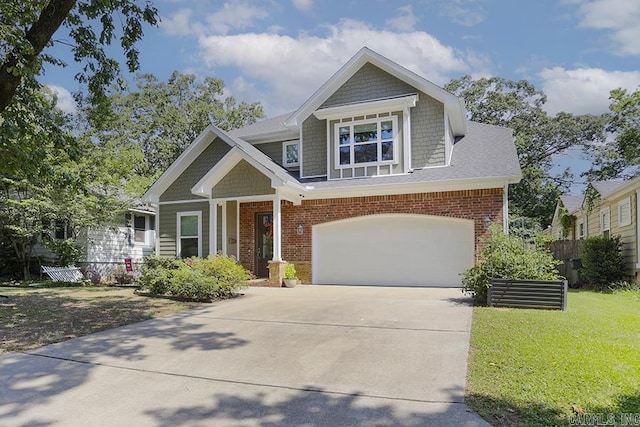 craftsman house featuring a front yard and a garage