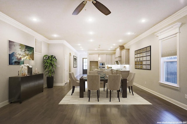 dining space with ceiling fan, crown molding, and hardwood / wood-style flooring