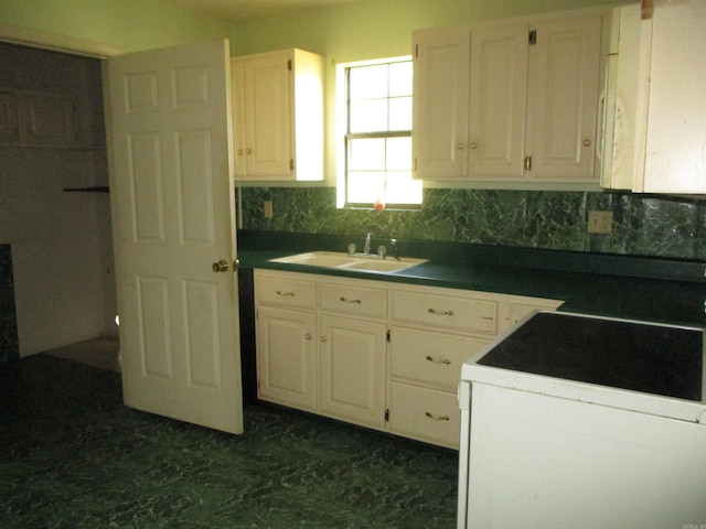 kitchen with sink, white cabinetry, and white electric stove