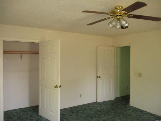 unfurnished bedroom with dark colored carpet, ceiling fan, and a closet