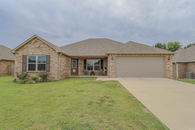 view of front of home with a garage and a front lawn