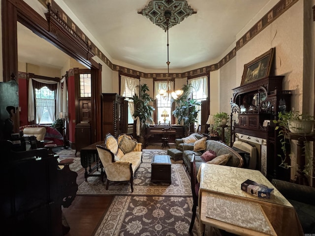 living area featuring a chandelier and hardwood / wood-style floors