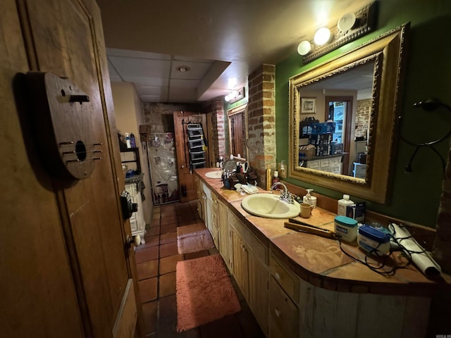 bathroom with tile patterned flooring and double sink vanity