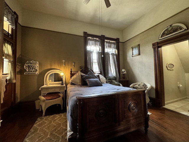 bedroom featuring ceiling fan and dark hardwood / wood-style flooring