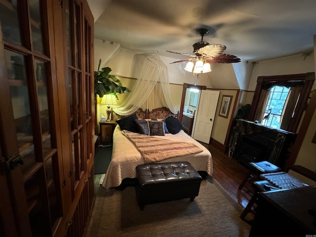 bedroom with ceiling fan and hardwood / wood-style flooring