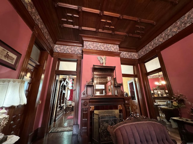 interior space featuring a tile fireplace, wood ceiling, and a towering ceiling