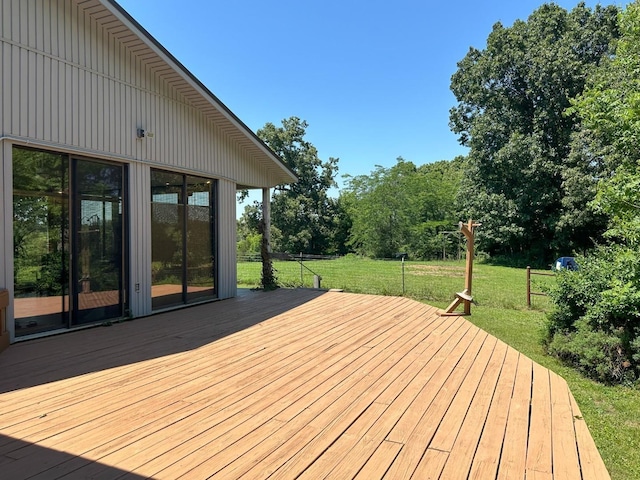 wooden terrace with a yard