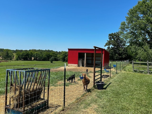 exterior space with a rural view and an outbuilding