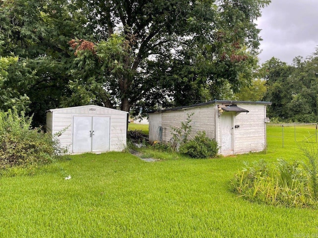 view of outdoor structure with a yard