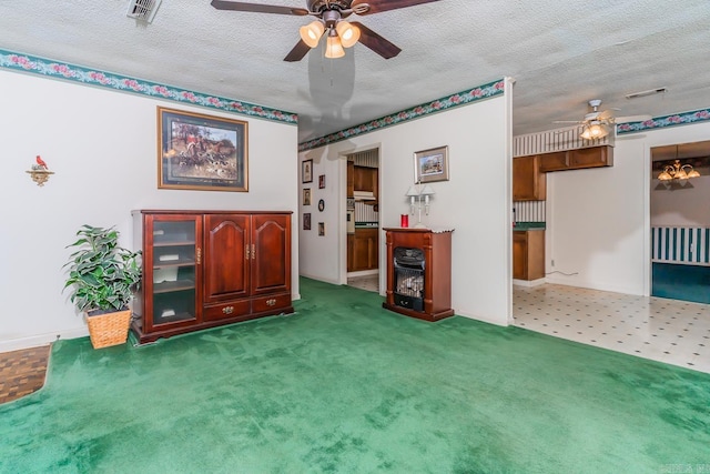 sitting room with carpet flooring, a textured ceiling, and ceiling fan