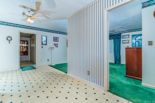 corridor featuring a textured ceiling