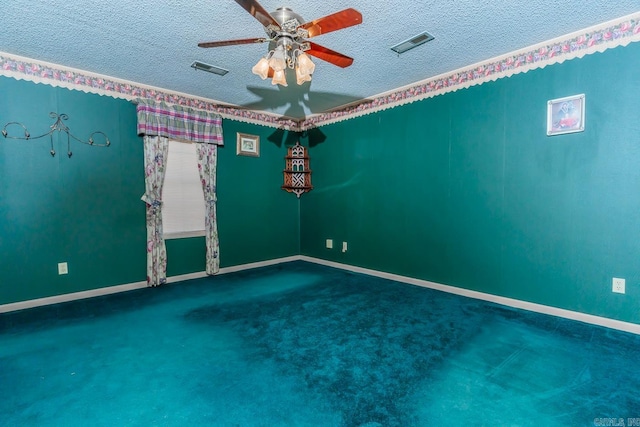 empty room featuring carpet, a textured ceiling, and ceiling fan